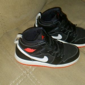 Two pairs of children shoes in size 10c.